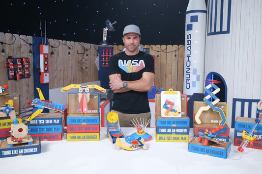 Photo of Mark Rober in Front of all Build Boxes for Summer Camp - in Space!