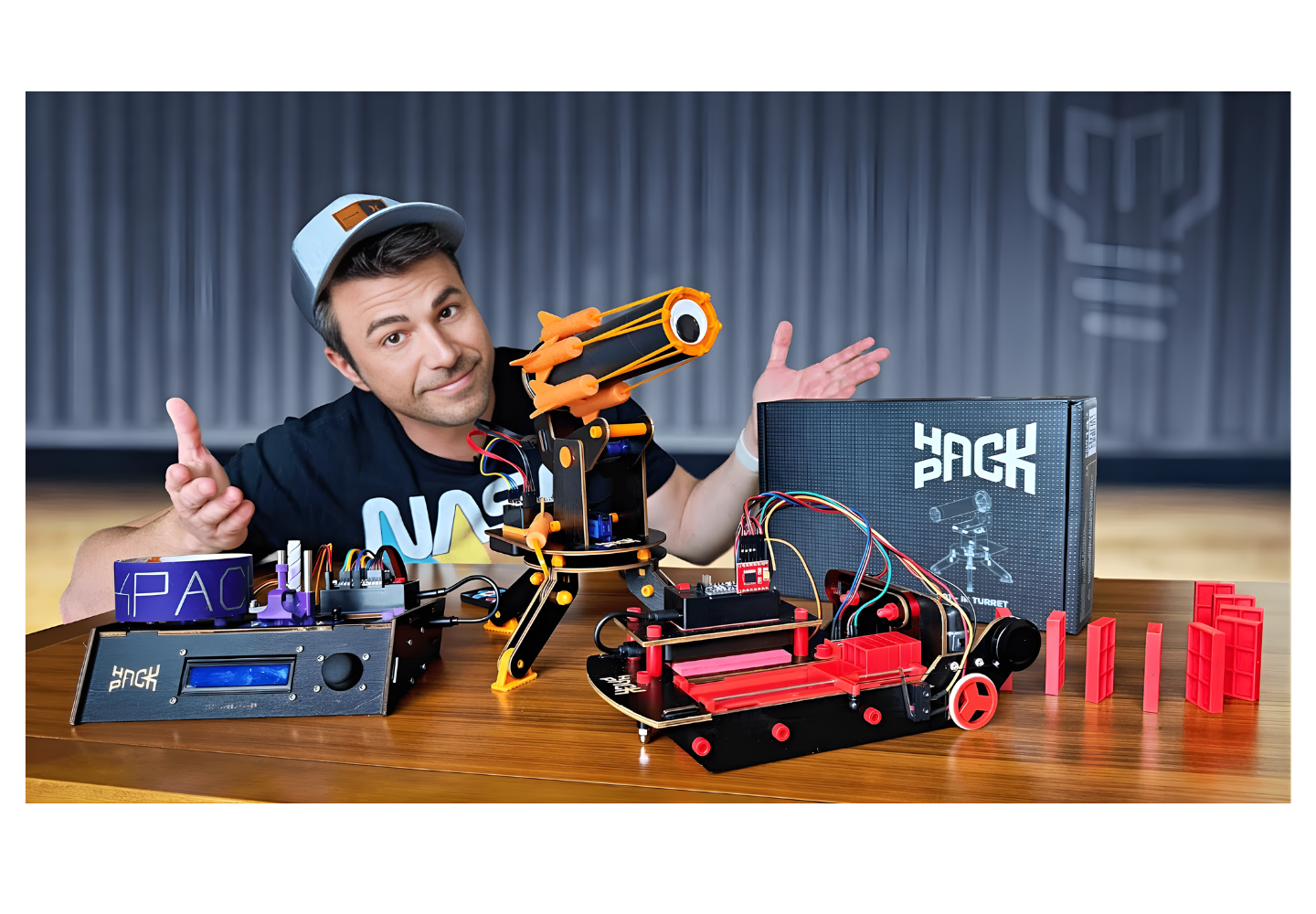 Photo of Mark Rober with Some Hack Pack Robots