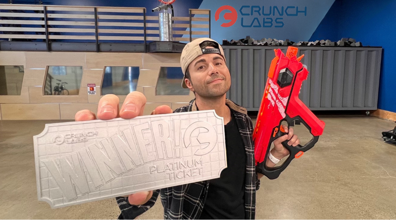Mark Rober Holding a Platinum Ticket at CrunchLabs