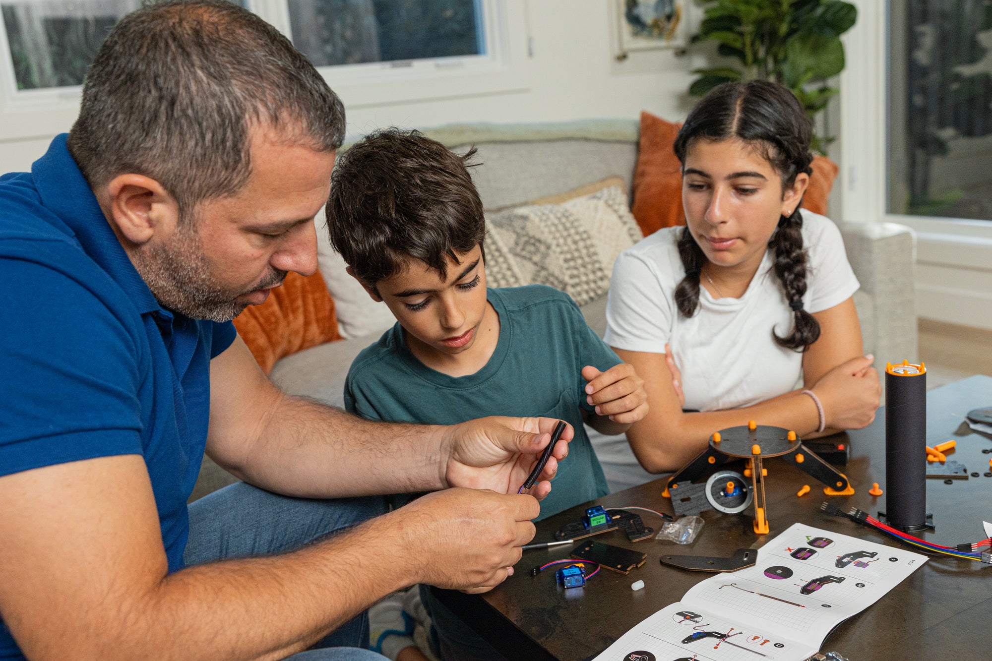 Family assembling CrunchLabs together