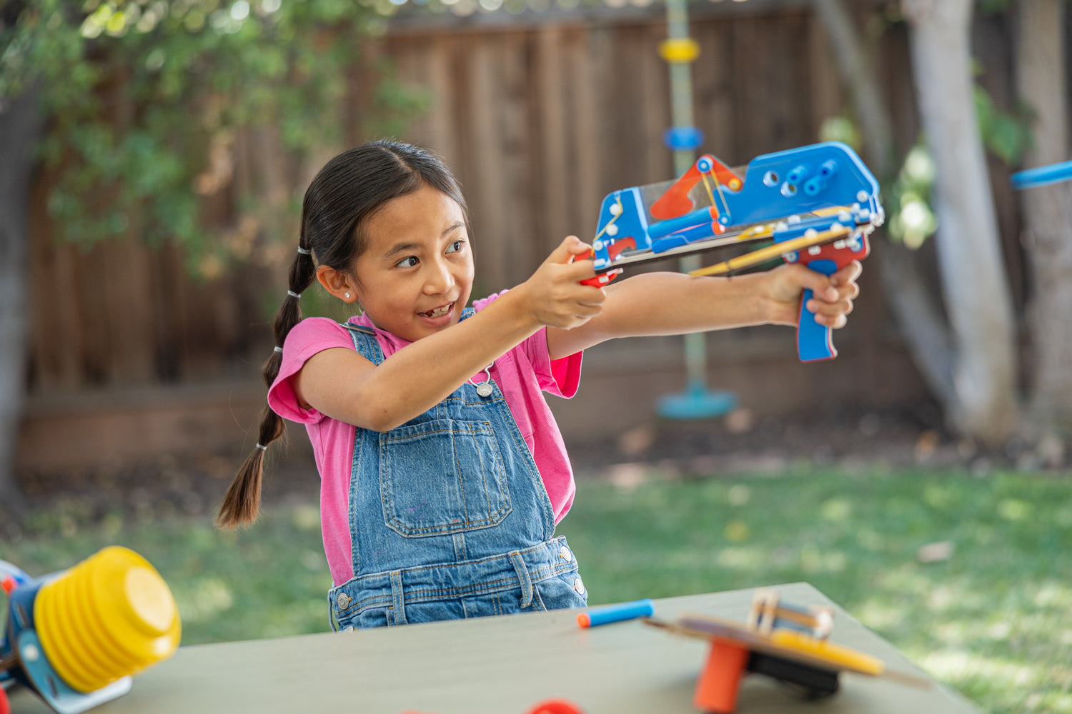 Photo of a Girl Playing Outside with Her Build Box