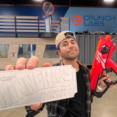 Photo of Mark Rober at CrunchLabs holding a Platinum Ticket