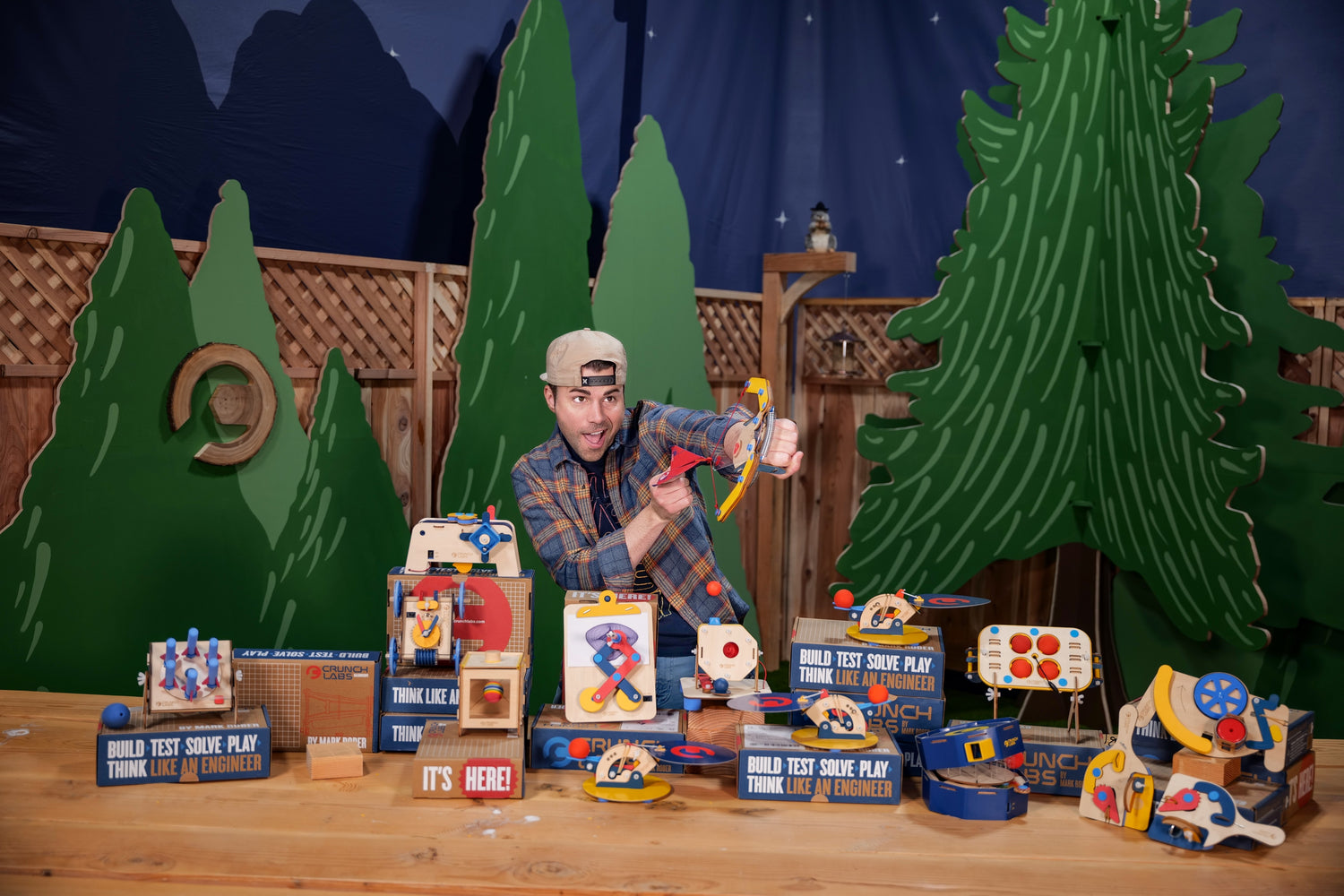 Photo of Mark Rober in front of a camp scene, with his Build Boxes