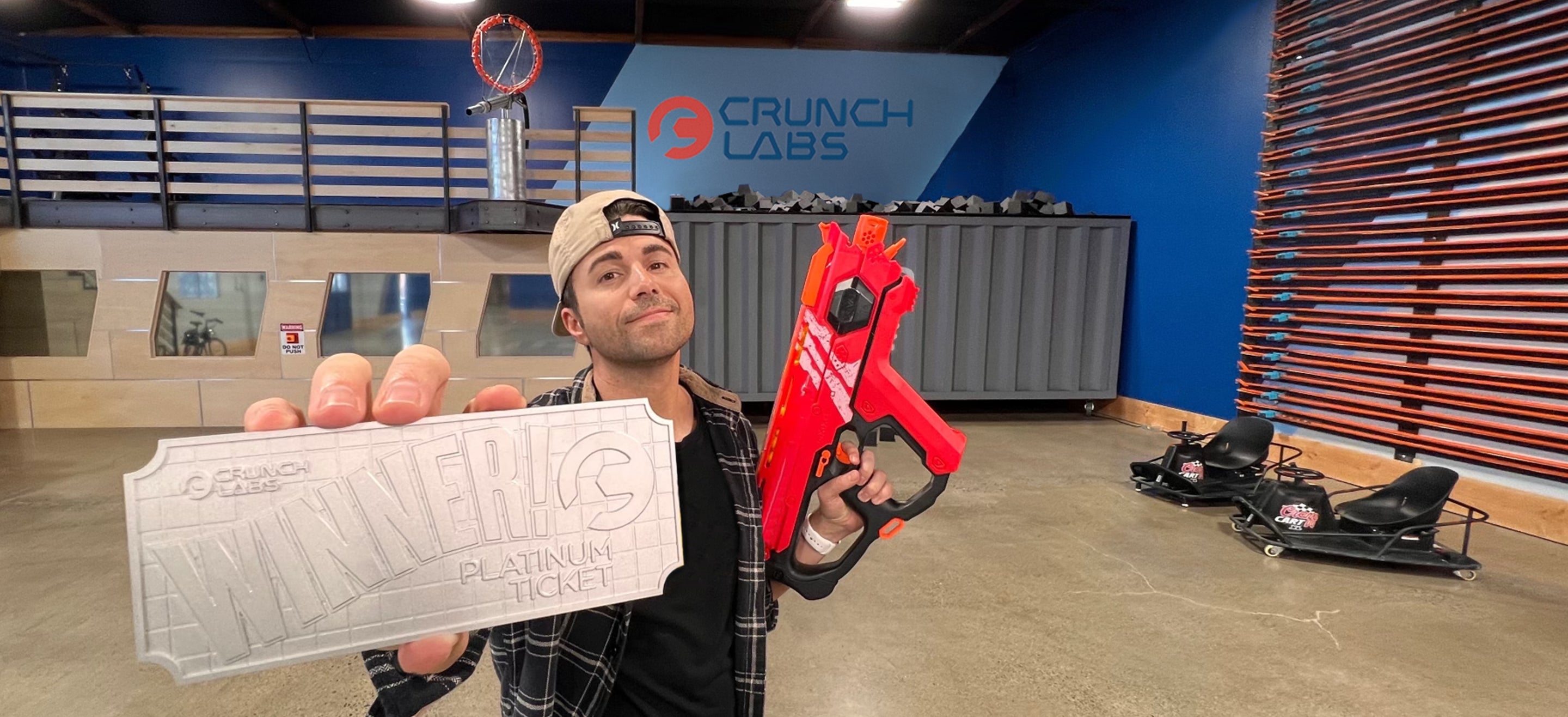 Photo of Mark Rober at CrunchLabs holding a Platinum Ticket